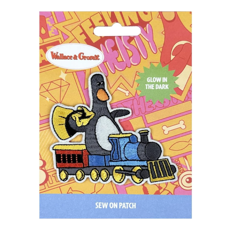 Wallace & Gromit glow-in-the-dark iron-on patch featuring Feathers McGraw riding a blue and yellow train