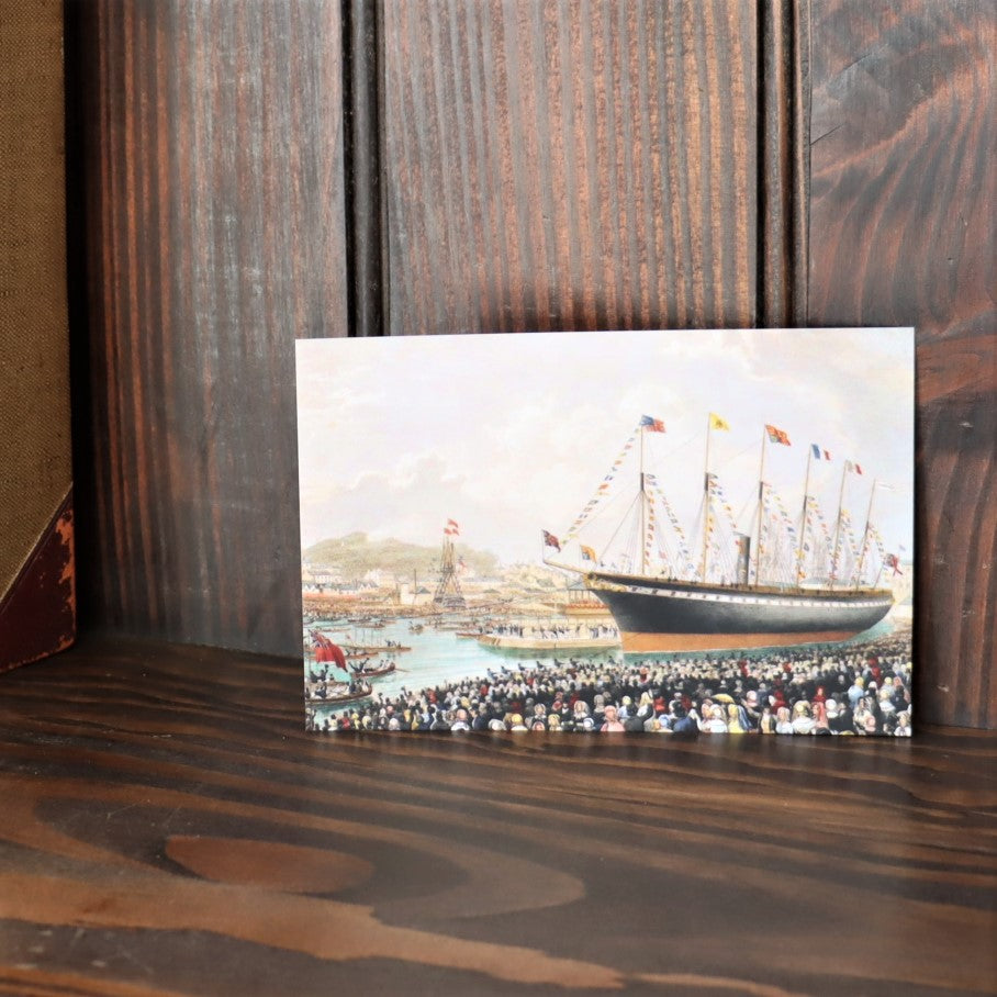 A postcard showing a reproduction of a historical watercolour painting of the launch of the SS Great Britain into Bristol's Floating Harbour.
