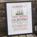 A framed print poster featuring a vintage advertisement for the SS Great Britain steamship with bold red and black text on a beige background.