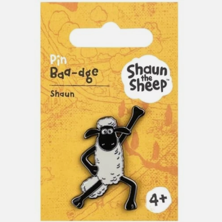 Enamel pin on a yellow backing card, featuring the character Shaun the Sheep in a dancing pose.